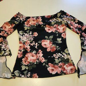 Soft floral blouse, spiral bell sleeves. Can be worn off the shoulder.
